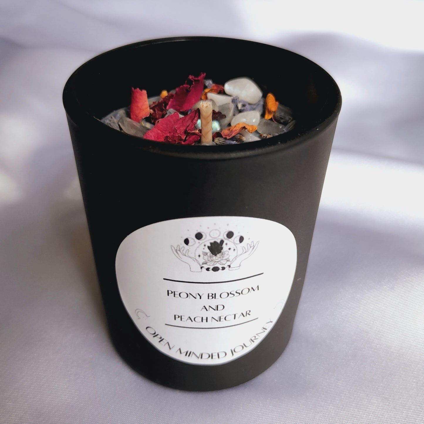 Handmade Crystal Candles: Experience luxury with these soy wax candles adorned with Labradorite Chips, Moonstone Chips, Rose petals, and Lavender petals. Each candle stands roughly 6.5cms, creating a harmonious fusion of aesthetic charm and soothing energies.