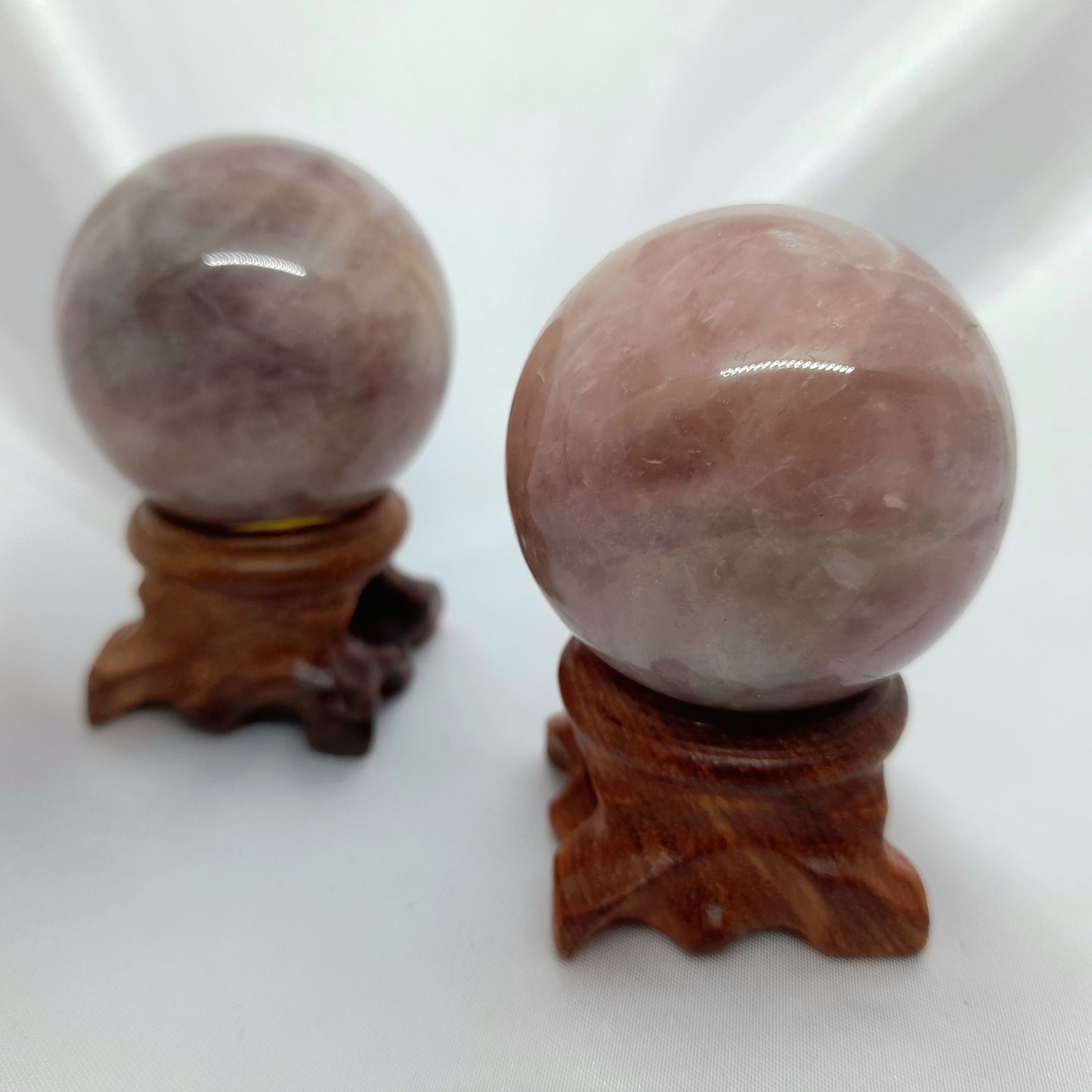 Lavender Rose Quartz Sphere: A healing crystal and symbol of unconditional love. This cherished sphere, weighing roughly 120g and measuring approximately 5cm in diameter, radiates strong vibrations of love. Please note, spheres do not come with stands. Crystal sizes and markings may vary. Price for one crystal.