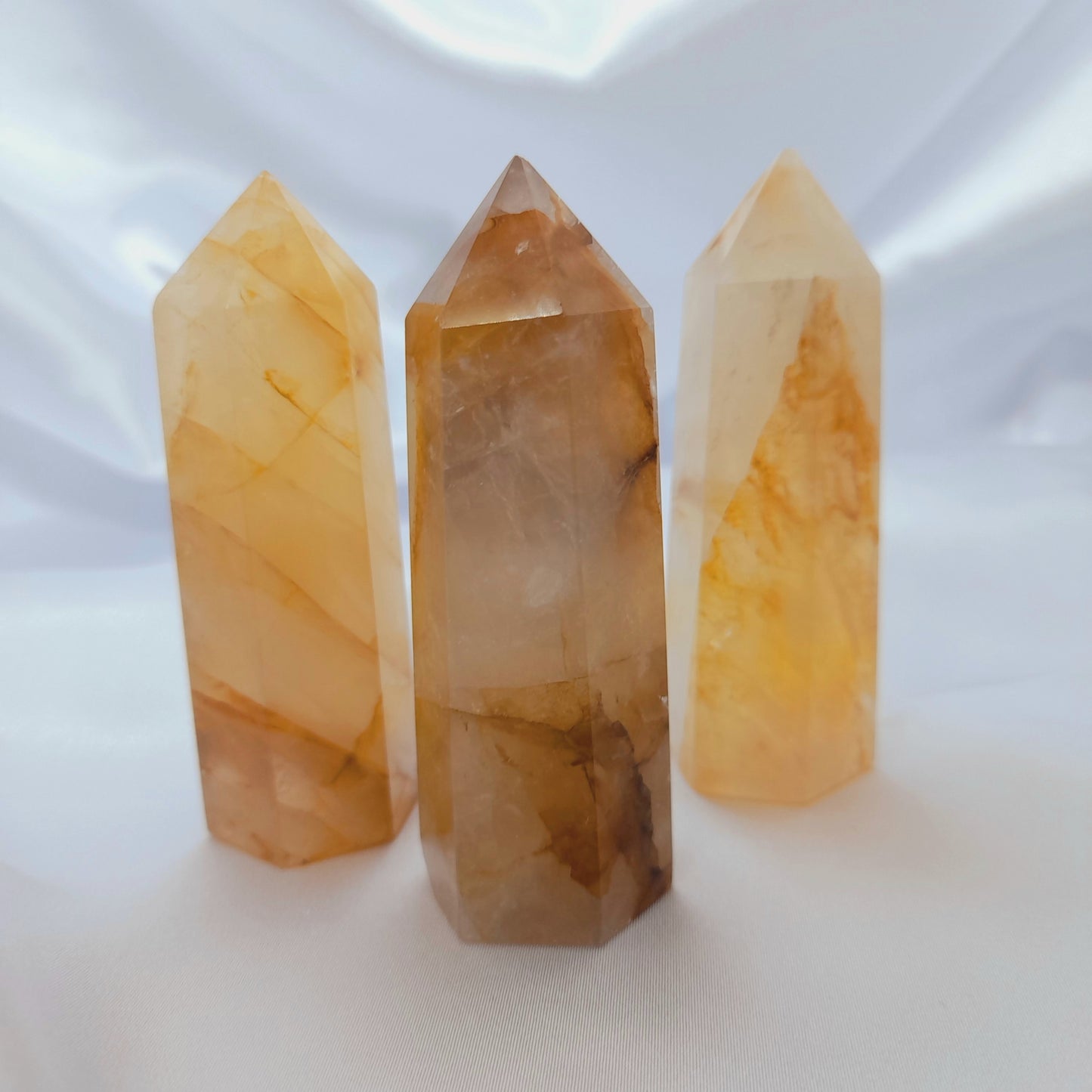 Golden Healer Crystal Point: A transformative gem with radiant golden hues, symbolizing purity and divine connection. Known for holistic healing in spiritual, mental, emotional, and interdimensional realms. Each crystal is unique; sizes and markings may vary. Price is for one crystal, inviting the profound healing energy of the Golden Healer into your life.