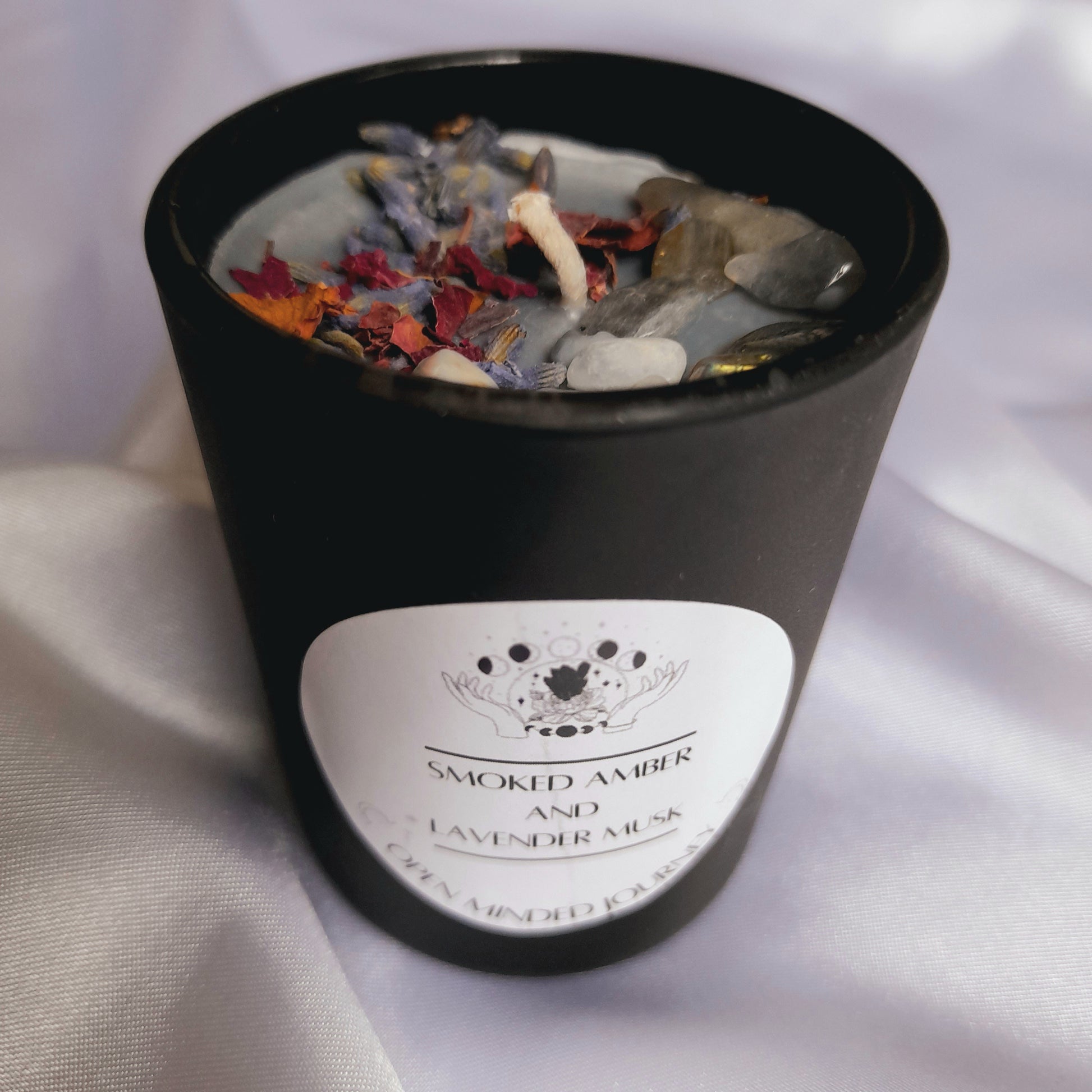 Handmade Crystal Candles: Experience luxury with these soy wax candles adorned with Labradorite Chips, Moonstone Chips, Rose petals, and Lavender petals. Each candle stands roughly 6.5cms, creating a harmonious fusion of aesthetic charm and soothing energies.