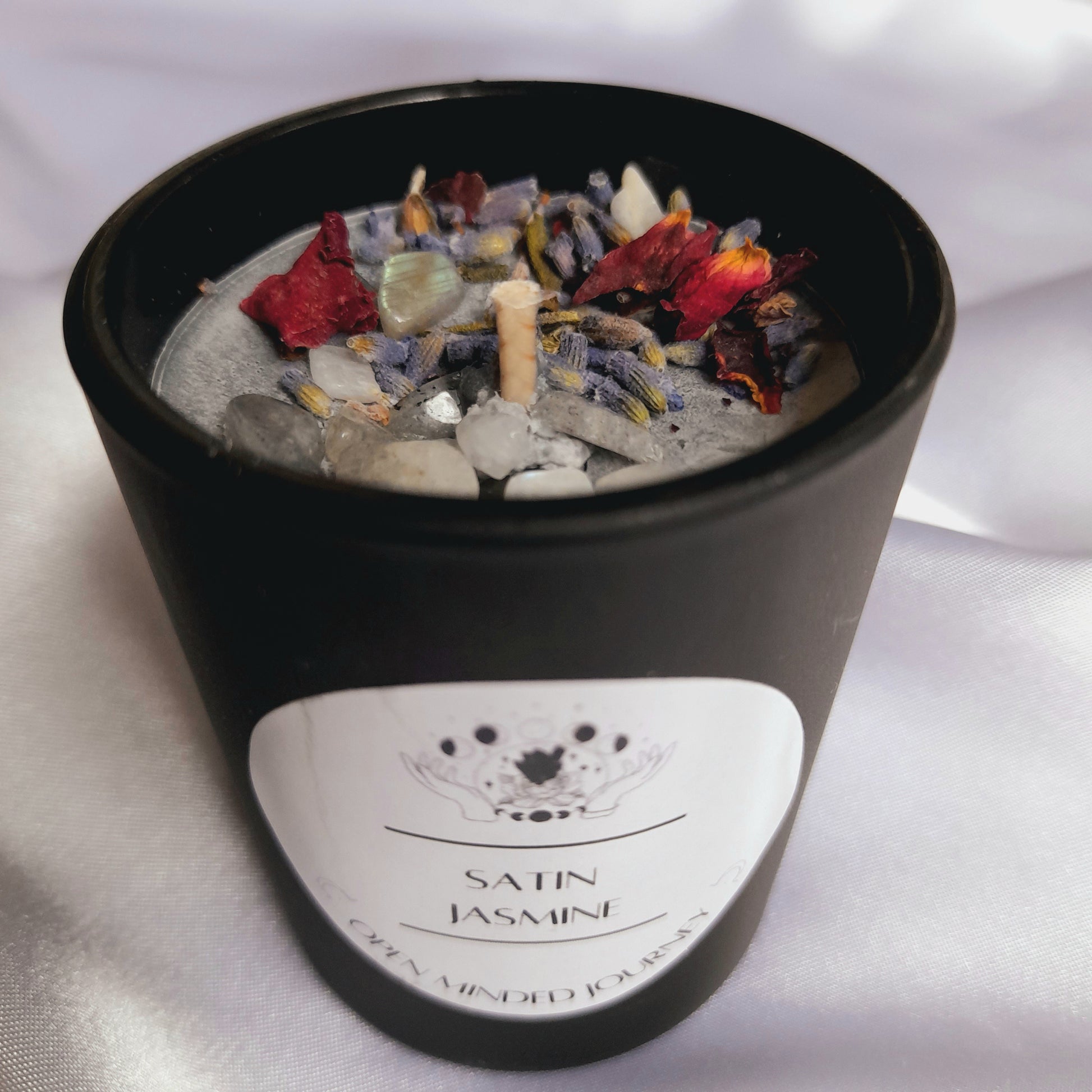 Handmade Crystal Candles: Experience luxury with these soy wax candles adorned with Labradorite Chips, Moonstone Chips, Rose petals, and Lavender petals. Each candle stands roughly 6.5cms, creating a harmonious fusion of aesthetic charm and soothing energies.