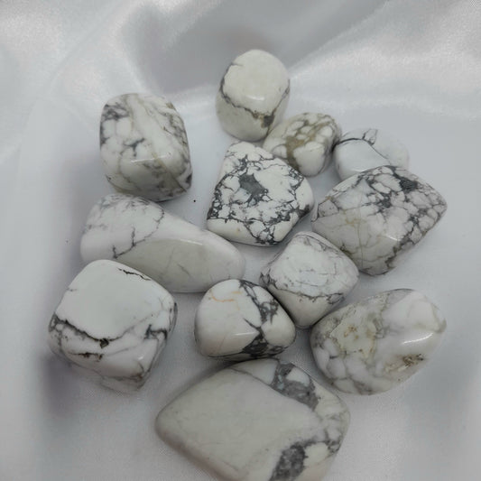 Howlite tumble | white crystal Boosts memory, aids concentration, and promotes restful sleep. Please note, spheres do not come with stands. Each crystal is unique; sizes and markings may vary. Price for one crystal