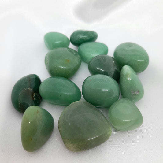 Green Aventurine Mini Tumble: A gorgeous green crystal known for luck, confidence, courage, and wisdom. Invite abundance into your life with this unique and captivating mini tumble. Crystal sizes and markings may vary. Price for one crystal.