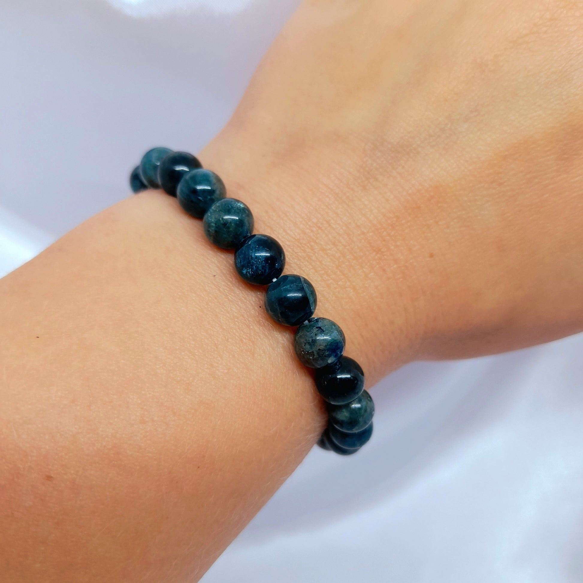Green Apatite Bracelet: A stunning dark green crystal known for boosting spiritual energy and inner magic. Enhance personal growth, motivation, and spiritual connection. Embrace the healing energies of Green Apatite as you wear this empowering bracelet.