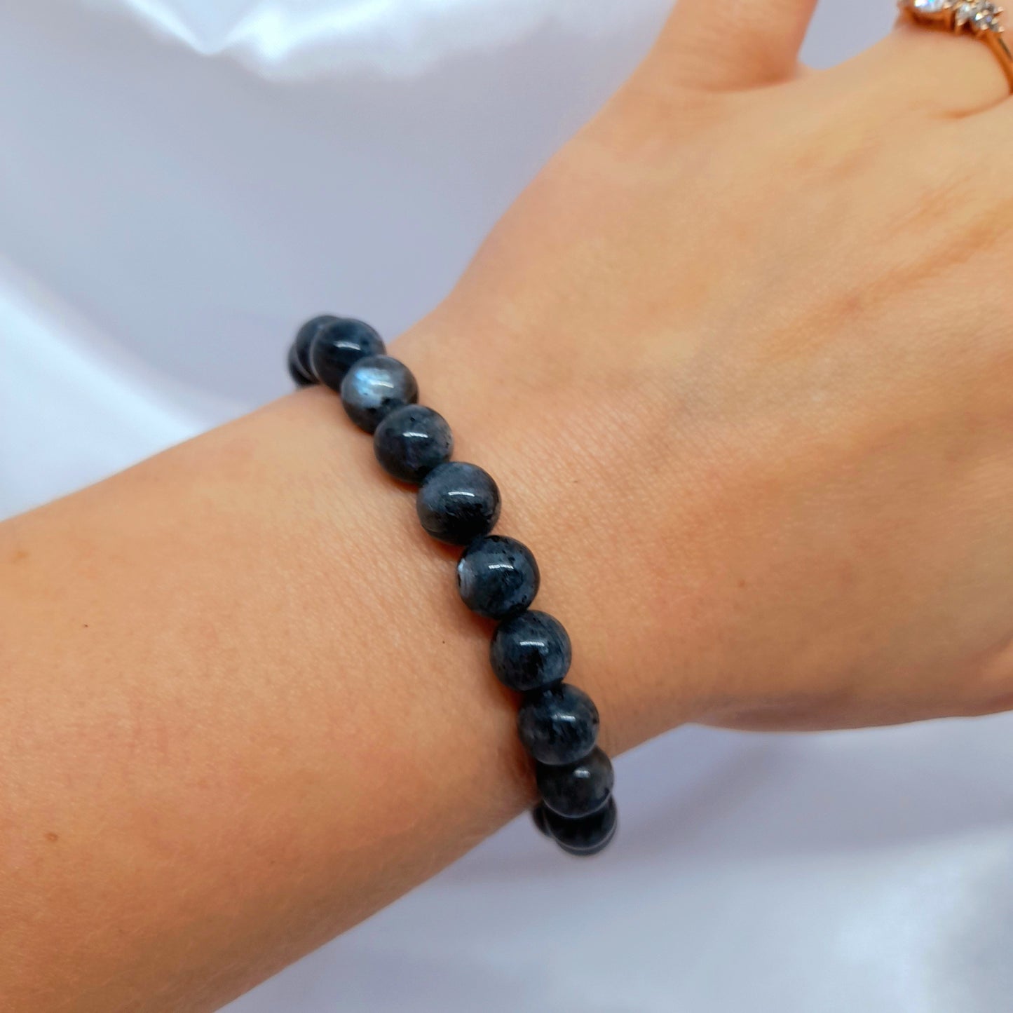 Larvikite Bracelet: Embrace the grounding and protective energies of Larvikite. This flashy crystal removes overwhelming thoughts, bringing strength, creativity, and self-confidence. Adorn your wrist with this unique and transformative bracelet.