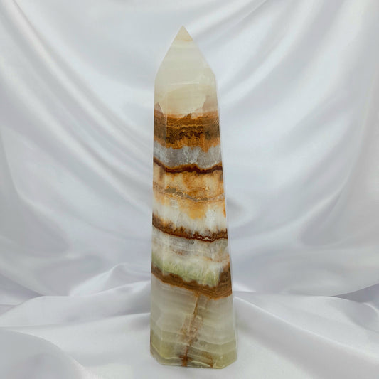 Green Banded Calcite Tower: A powerful crystal, also known as Green Onyx, fostering forgiveness and openness. 