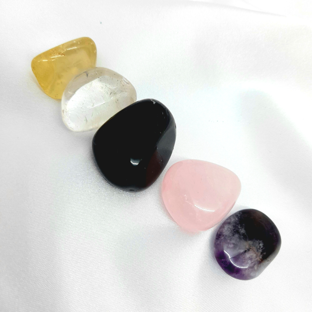 Crystals for Beginners Bundle: Clear Quartz, Amethyst, Rose Quartz, Citrine, and Black Obsidian. Enhance your journey with versatile and powerful crystals known for amplifying energy, calming properties, love, abundance, and grounding protection.