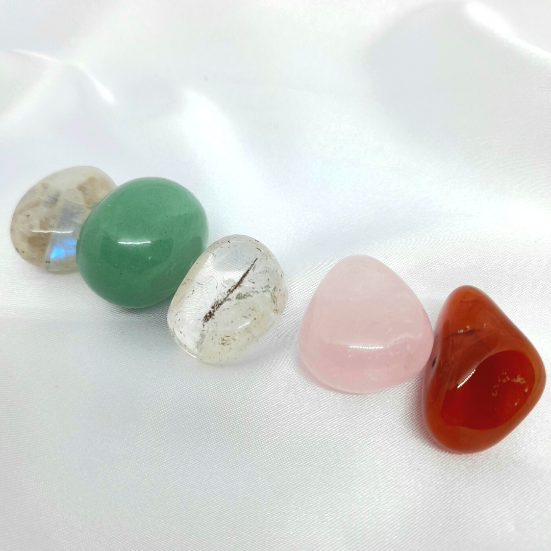Help Me Get Pregnant Bundle: Rose Quartz, Moonstone, Carnelian, Green Aventurine, and Clear Quartz crystals. Aids emotional healing, regulates hormones, balances sacral chakra, fosters emotional balance, and supports overall well-being for those on the journey to conceive.